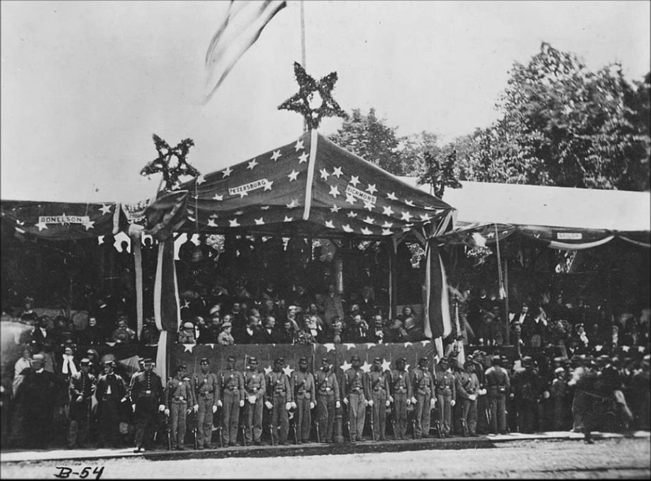 President Johnson left of center in first row of reviewing stand.jpg President Johnson left of center in first row of reviewing stand.jpg