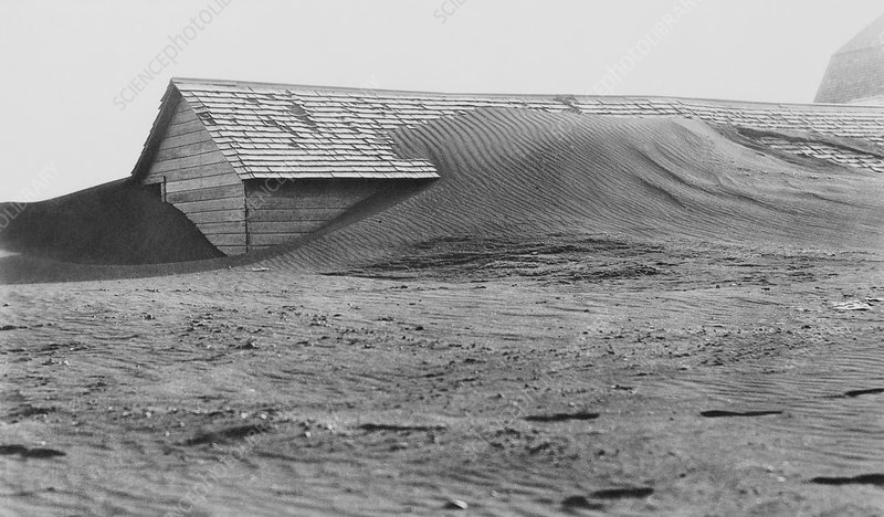 C0130231-Soil_drifting_over_US_farm_building,_1935.jpg