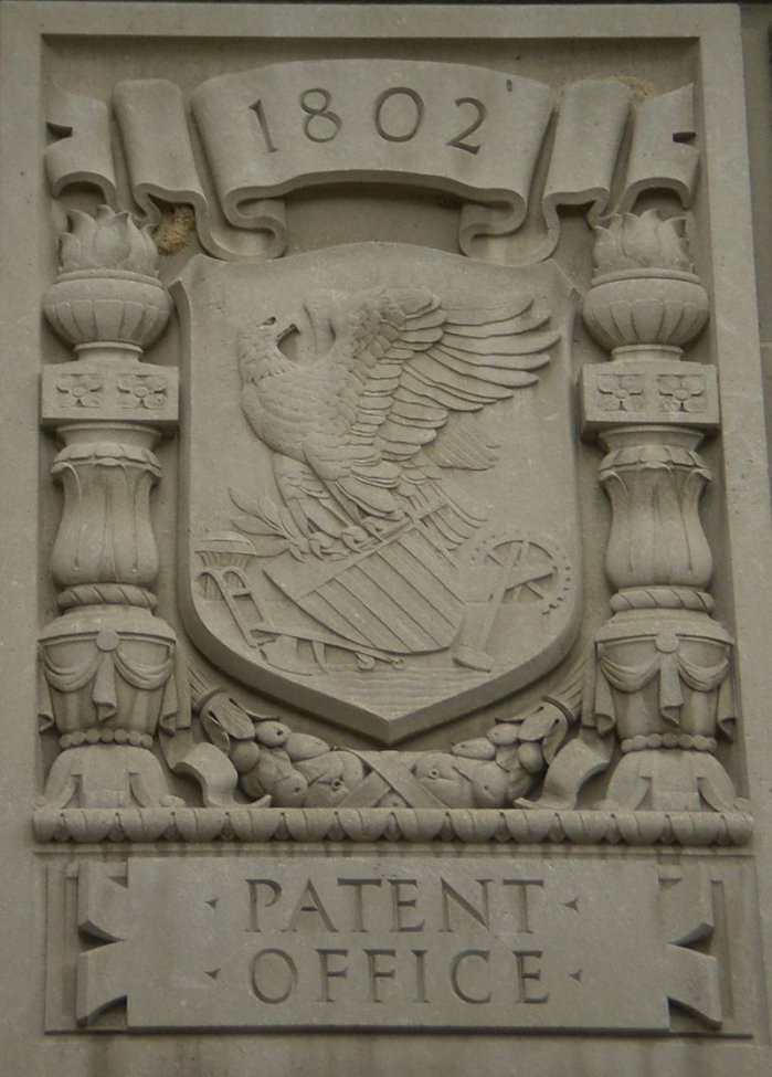800px-Patent_Office_relief_on_the_Herbert_C._Hoover_Building (1).jpeg 800px-Patent_Office_relief_on_the_Herbert_C._Hoover_Building (1).jpeg